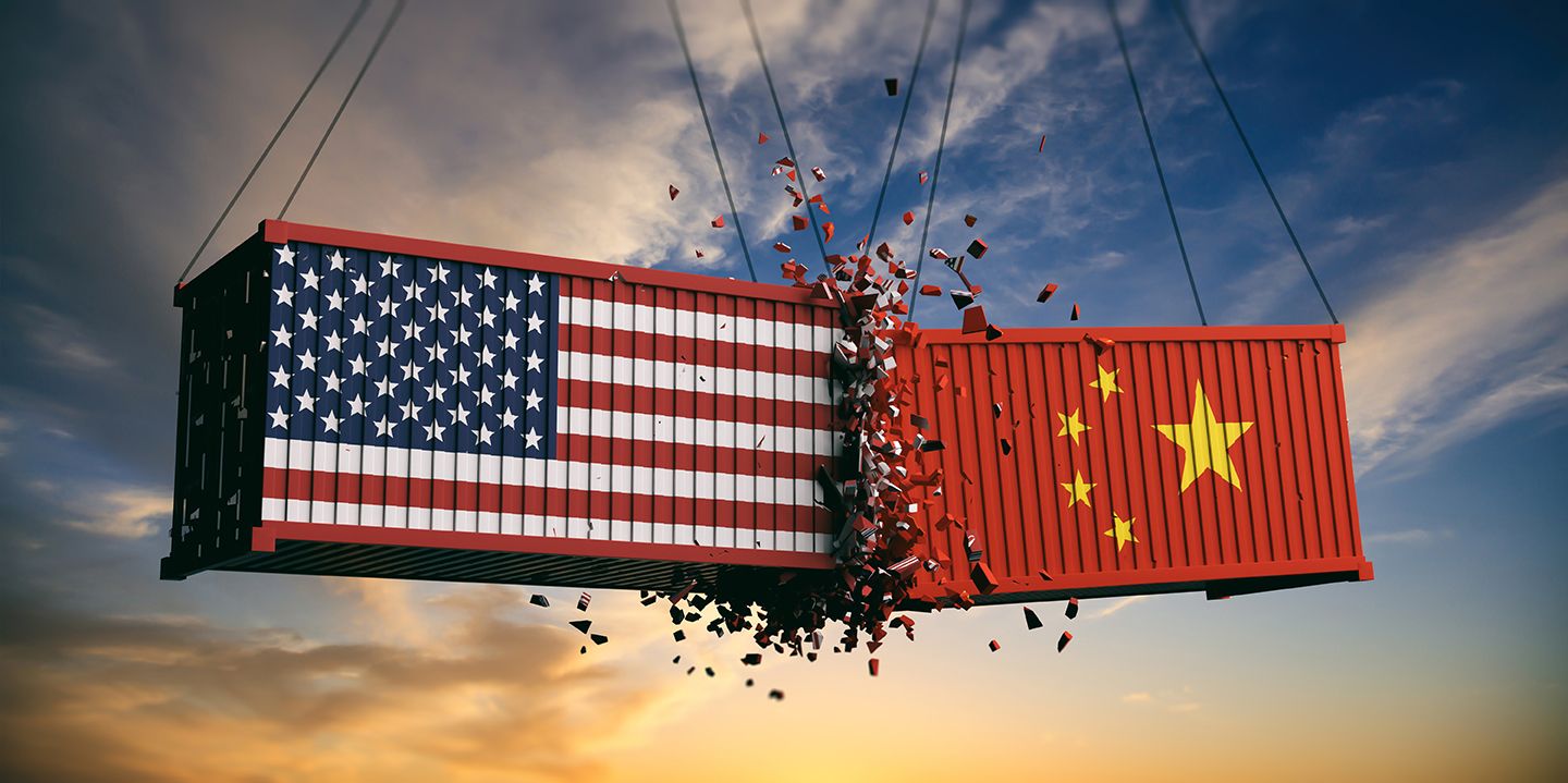 US of America and Chinese flags crashed containers on sky at sunset background